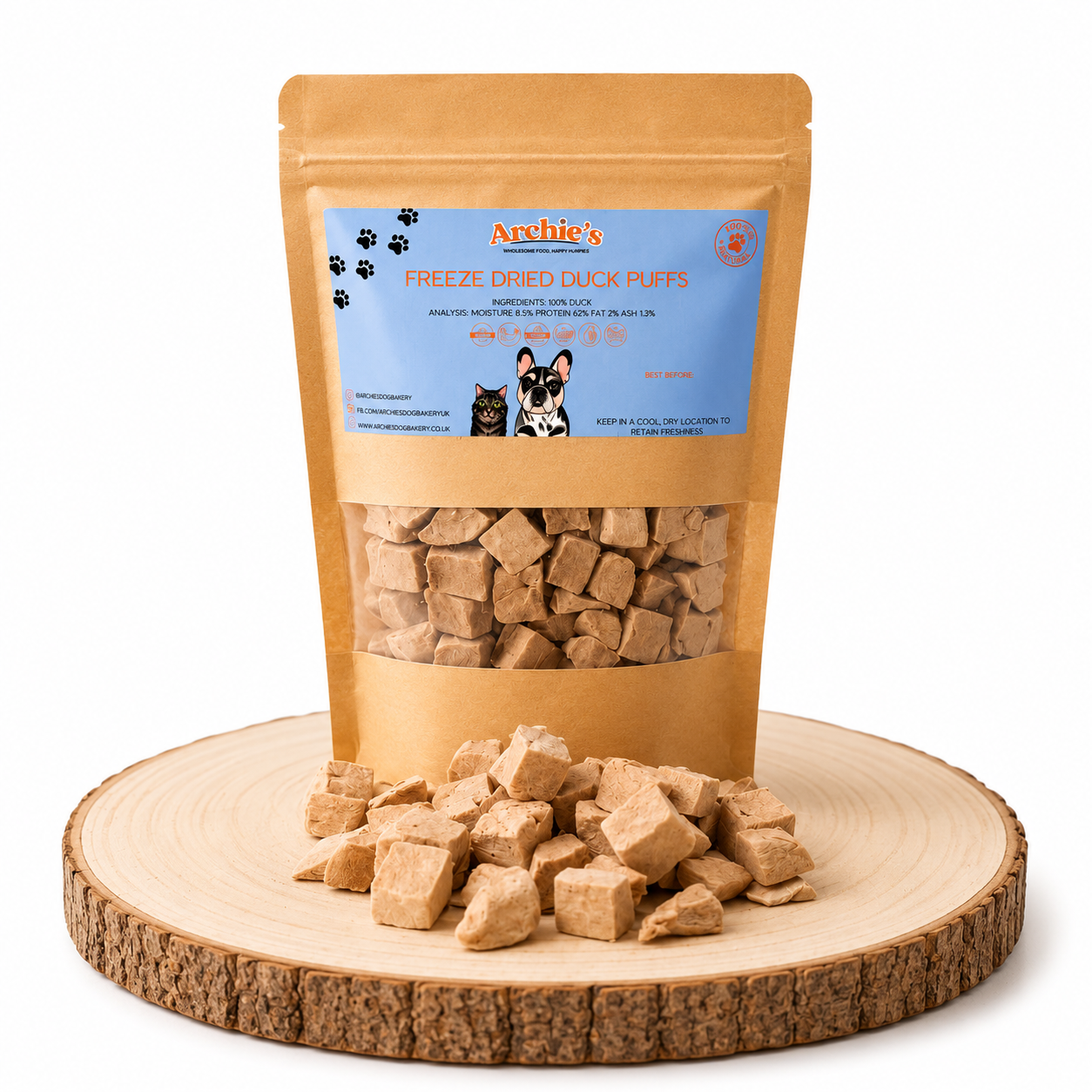 Freeze dried duck dog and cat treats displayed on a wooden log.