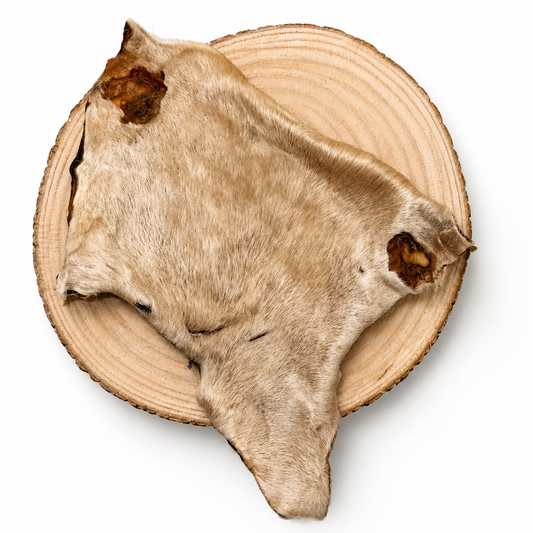 Beef bark with hair dog treat displayed on a wooden slice, natural pet treat for dogs.