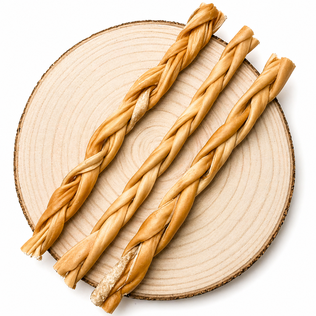Braided beef dog chews arranged diagonally on a natural wooden slice.