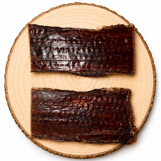 Natural beef gullet dog chews displayed on wooden board, durable long-lasting treats for dogs.