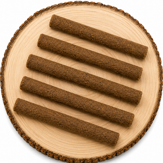 Beef infused dog chew sticks displayed on a natural wooden log slice with a clean white background