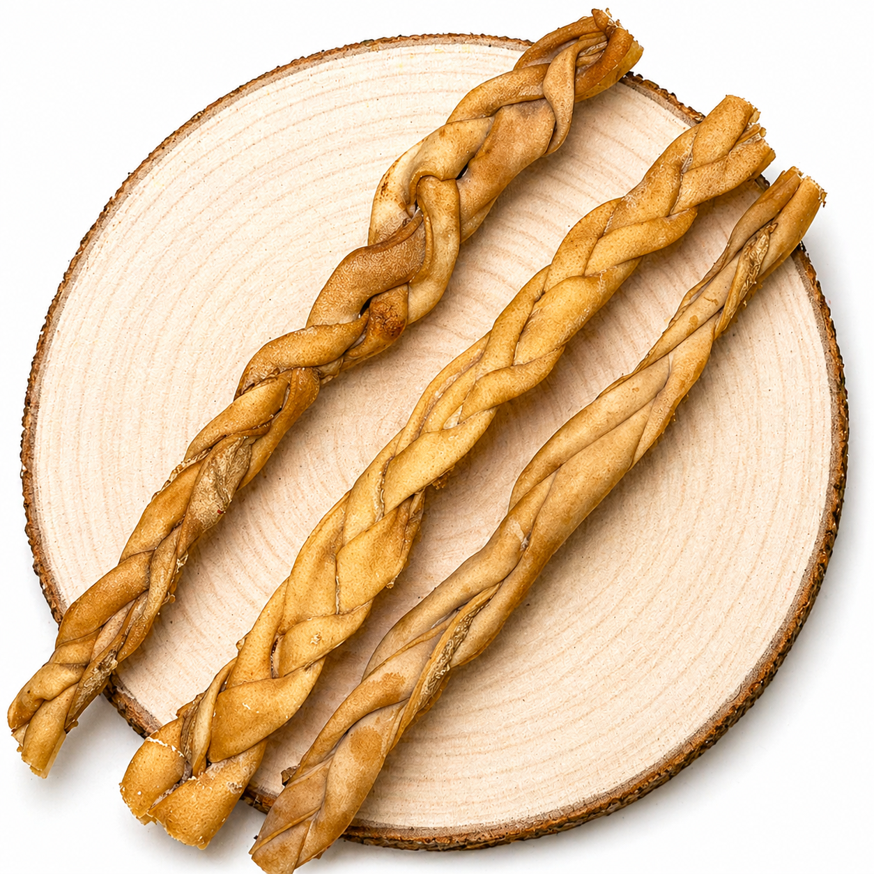 Braided lamb dog chew sticks on wooden display.