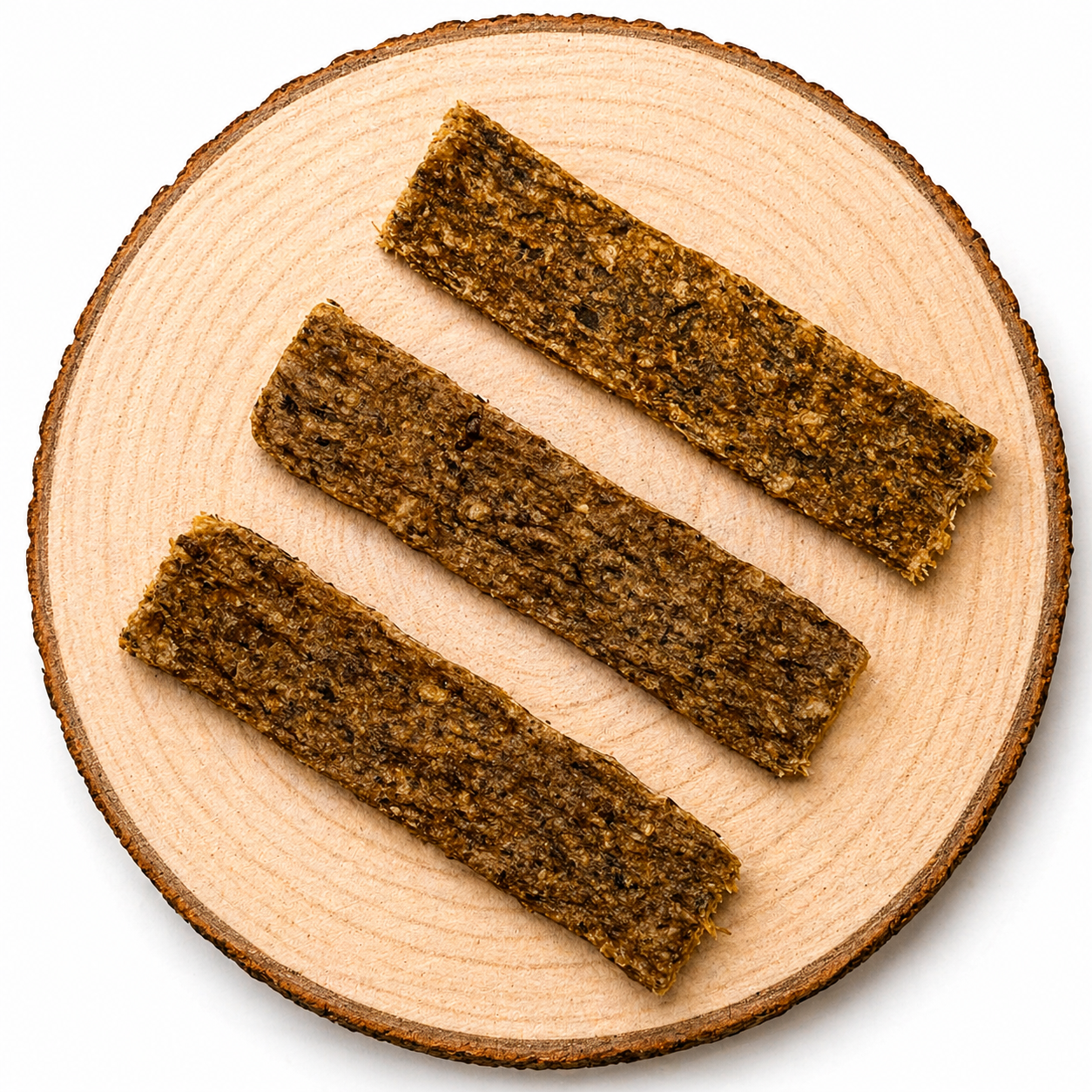 Grain-free meaty dog treat strips in boar, venison, duck, rabbit and lamb flavours on wooden board