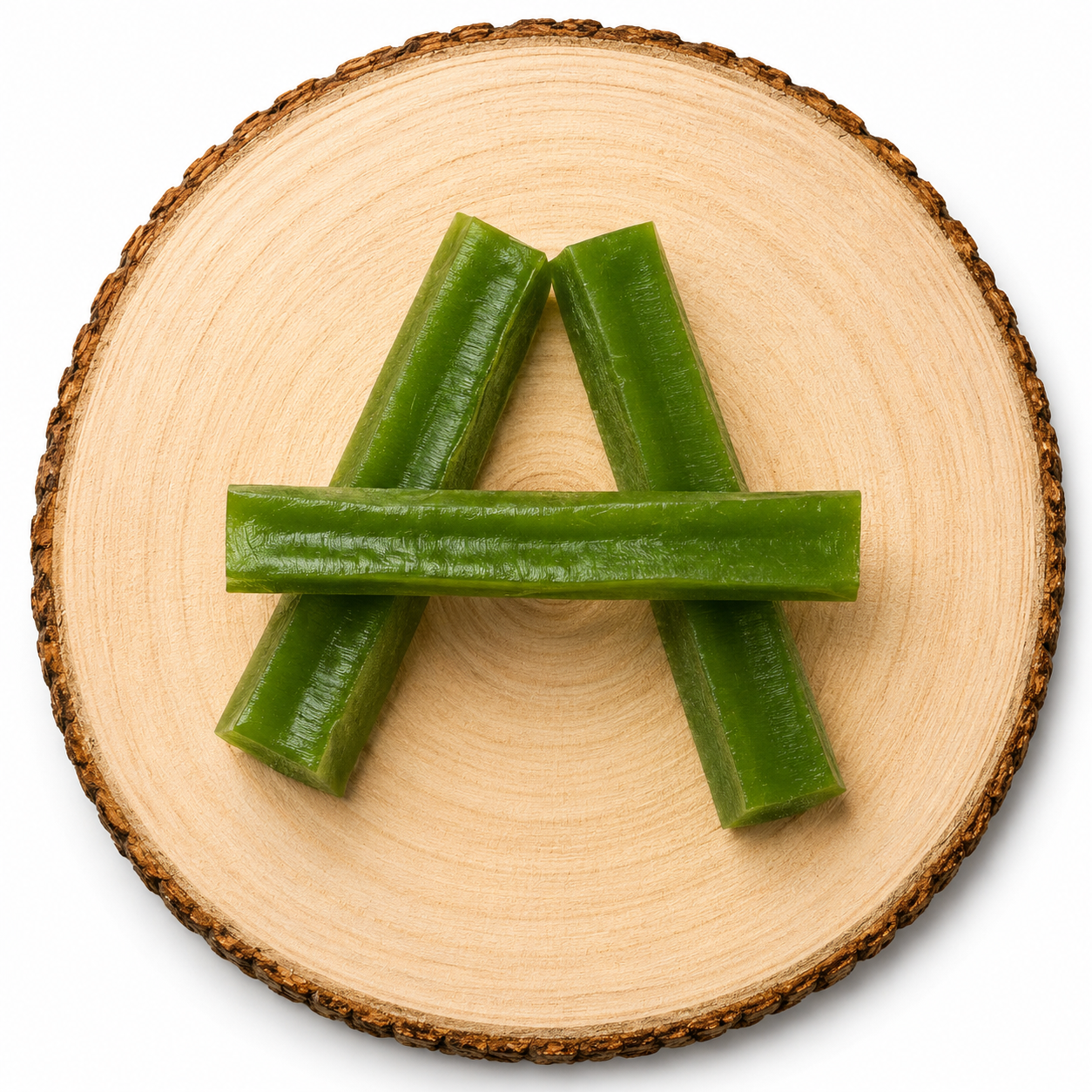 Mint yak dog treat on wooden log