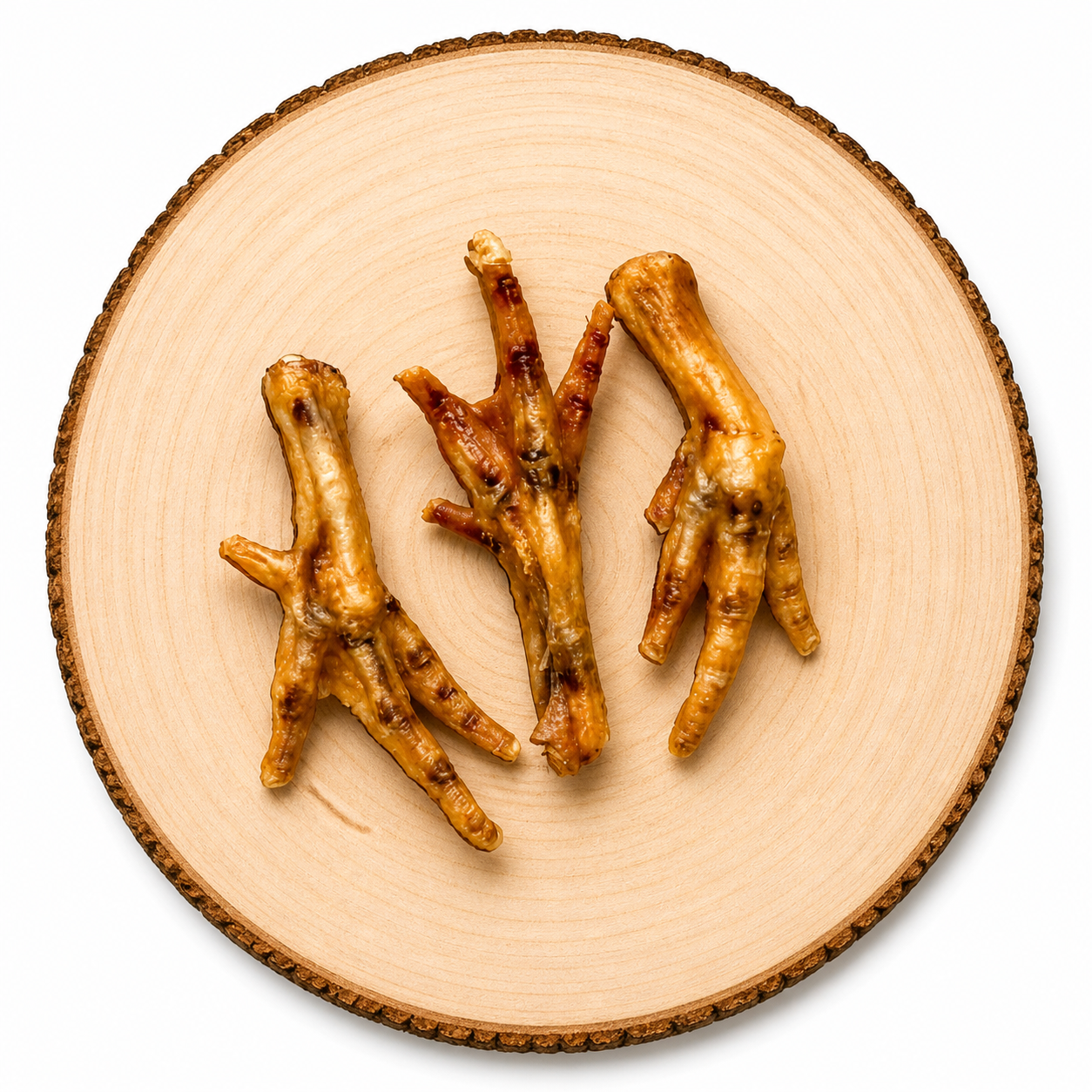 Natural chicken feet dog treat on a wooden log. High protein dog treats for teethe cleaning
