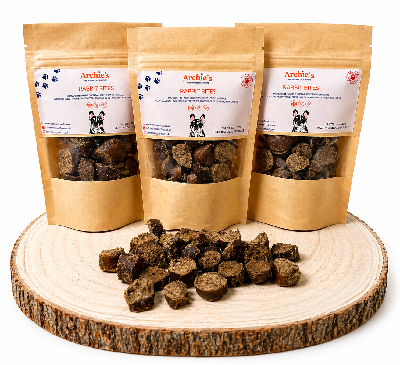 Rabbit bites dog treats in resealable pouches with natural training treats displayed on wooden log