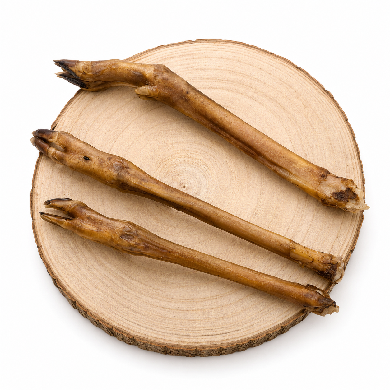 Roe Deer leg natural dog treat on a wooden log.